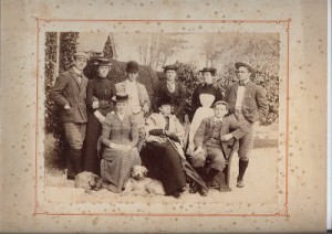 The Wright family, outside The Manor, 1893. Squire Wright stands on left, then a student at St John's College, Oxford. He's next to his sister Miss Margaret. Louisa Burkinshaw is sitting at the front, on left, next to her mother Eliza, notably difficult. Sitting on right is young Parsons, still at school.