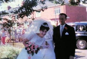 Susan arrives outside St Hugh's with her father. Sunny but caught by a gust of wind