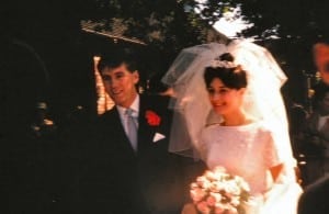 Just married, John and Susan greet their wedding guests