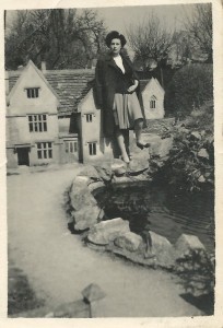 Peggy poses at the Model Village, Bourton, about 1949.